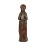 A large 19th century carved oak standing figure of a female saint