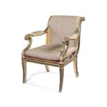 A Regency carved giltwood and ebonised open armchair in the manner of Henry Holland