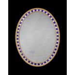A large 18th century style Irish carved giltwood and cut glass beaded oval mirror