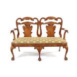 A late 19th century George I style figured walnut double chair back sofa