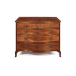 A George III mahogany serpentine dressing chest attributed to Gillows