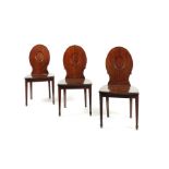 A set of three George III mahogany hall chairs