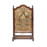 An 18th century French walnut and needlework fire screen