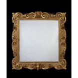 A 17th century Italian carved giltwood frame with later mirror plate