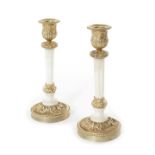 A pair of late 19th century gilt bronze and white marble candlesticks