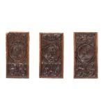 A set of three Romayne head oak panels, French, 16th century and later
