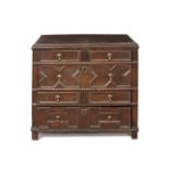 A late 17th century oak four drawer chest