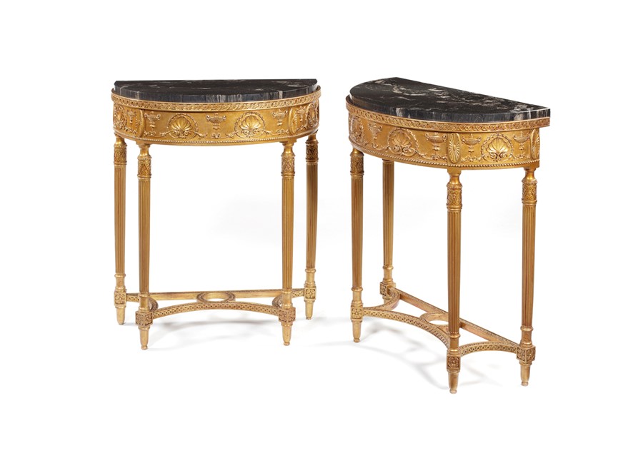 A pair of late 19th century neo-classical carved gilt wood and composition console tables