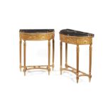 A pair of late 19th century neo-classical carved gilt wood and composition console tables