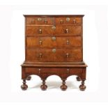 A William and Mary walnut and crossbanded chest on stand