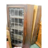 A pair of oak corner cupboards, 20th century, with glazed and leaded doors.