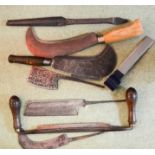 A quantity of tools including a draw knife, hole driller, Severock Billhooks, a Froe and others.