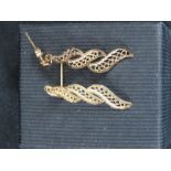 A pair of 9ct gold leaf design earrings.