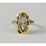 A yellow metal ring with crystal marquise cut stone, 2.6g.