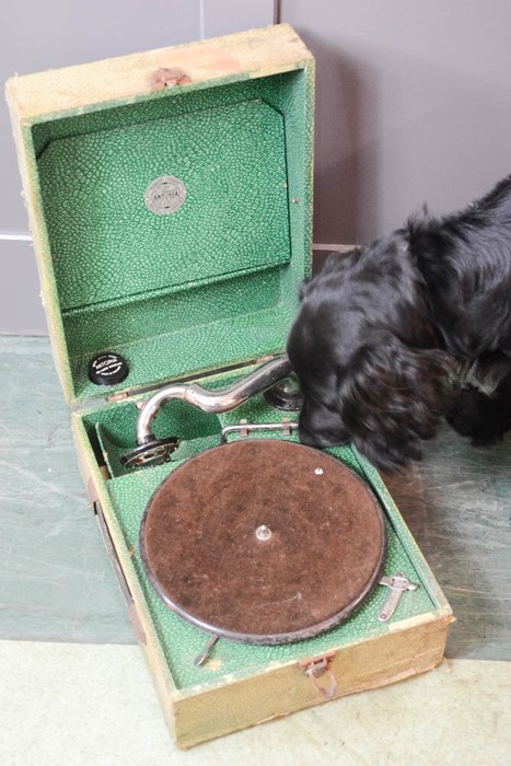 A table top boxed record player.