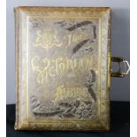 A Victorian musical photograph album, each page illustrated and having a musical mechanism inside.