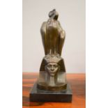A bronze pharaoh head with vulture upon its head, 31cm high.
