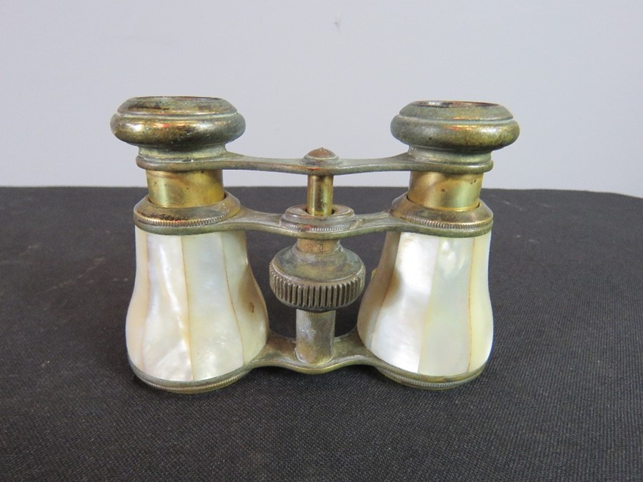 A pair of French mother of pearl clad opera glasses.