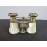 A pair of French mother of pearl clad opera glasses.