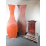Two wooden pampas grass vases, and a stand.