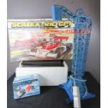 A Scalextric in original box together with a model crane in blue and other toys.