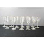 A set of twelve Victorian crystal glasses with gilded rims.