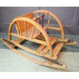 A child's wooden rocking & bouncing chair with play beads.