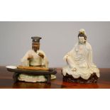 Two Japanese stoneware figures, man beside a table and a seated woman 20cm high, with calligraphy