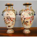 A pair of Chinese vases, with peacock form handles, 41cm high.