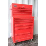 A large red Talko metal tool chest on chest, containing various tools.