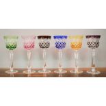 A set of six coloured cut crystal German wine glasses.