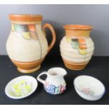 Two Crown Ducal examples, one jug, no.145 and one vase, no.267, two Poole pottery pieces and a