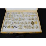 A box of military shoulder and lapel badges/buttons, various regiments.