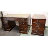 A 20th century mahogany partners desk with green leather top, and a matching cabinet.