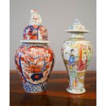 Two Chinese vases & covers, one in red white and blue, the other enamelled with flowers,