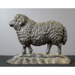 A cast iron door stop in the form of a sheep.