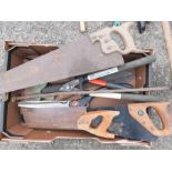 A group of tools to include saws, clippers etc.