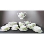 A Japanese bone china part tea service, with images of geisha girls impressed to the bases.