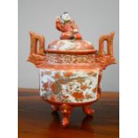 A 19th century Chinese Satsuma style jar, with a cover surmounted by a child with drum, raised on