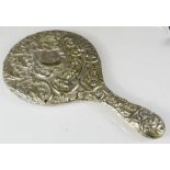 A silver clad hand mirror.