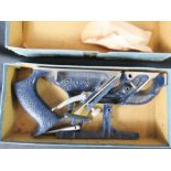 A metal woodworking plane, boxed.