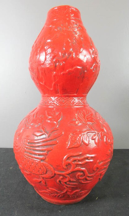 A red Chinese gourd vase, 32cm high.