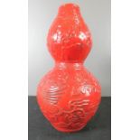 A red Chinese gourd vase, 32cm high.