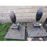 A pair of cast iron gate finials, of pineapple form.