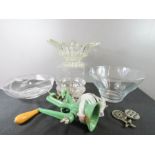 A group of glassware and a green mincer.
