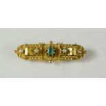 A 15ct gold sweetheart brooch set with four seed pearls and green square cut topaz to the centre,