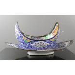 An Indian enamelled metal bowl and saucer, hand painted with decoration and vistas.