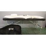 A BTM Professional Sports therapy table, with carrying bag.