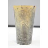 A carved horn beaker, engraved with prisoner of war style decoration, 11cm high.