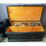 A large tool chest containing various tools, the four sliding drawers containing twelve chisels,